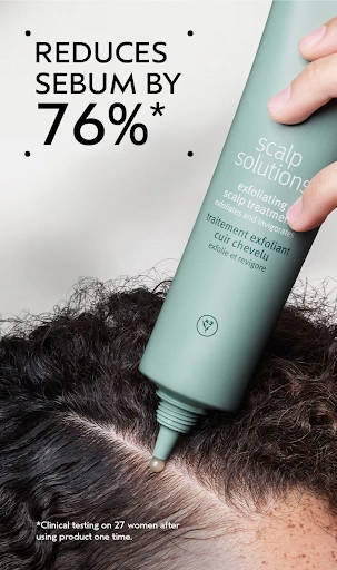 A hand applies scalp exfoliant from a green tube to a person's scalp, with text stating the product reduces sebum by 76% after one use, based on clinical testing. - Get Panache, FL